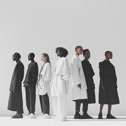A minimalist image of models standing side by side, dressed in monochrome Kokotete outfits styled differently to highlight their individuality. The group includes a variety of ethnicities and body types, showcasing that simplicity can be empowering and inclusive when paired with thoughtful design.